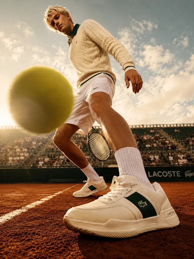Tennis campaign with a player and ball in motion