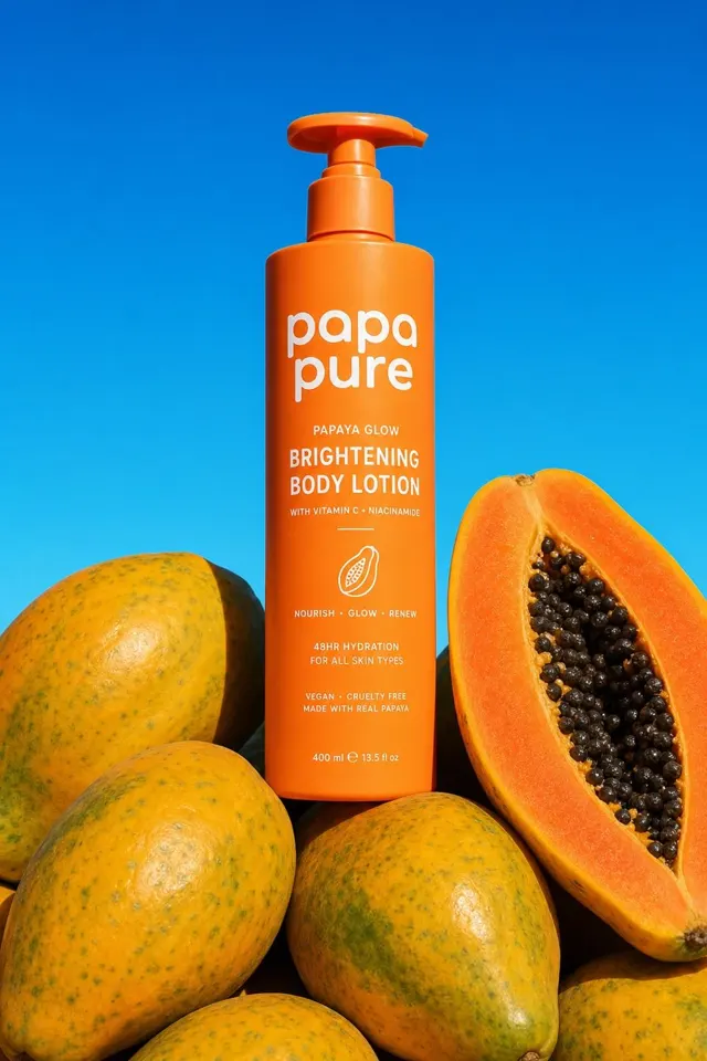 Orange papaya skincare bottle against a blue sky